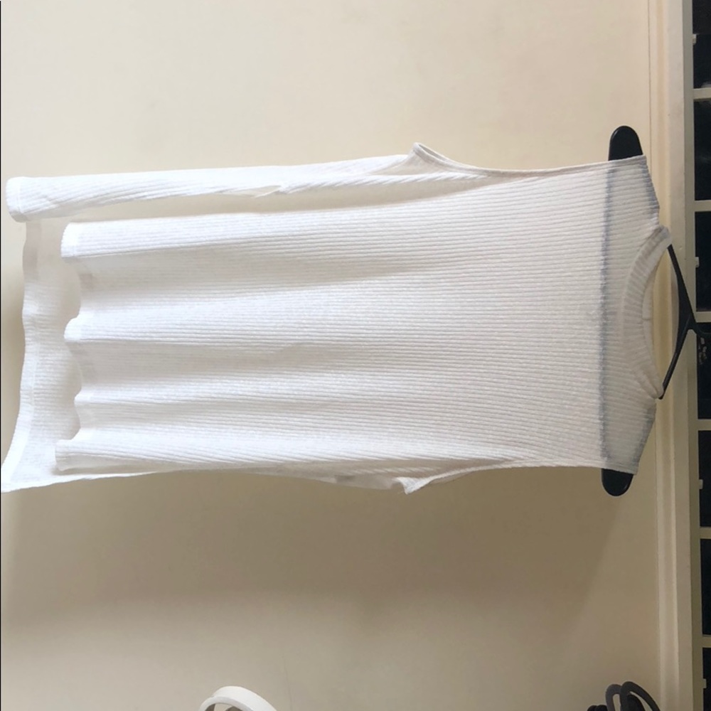 Sheer white. Turtle neck. Sleeveless.